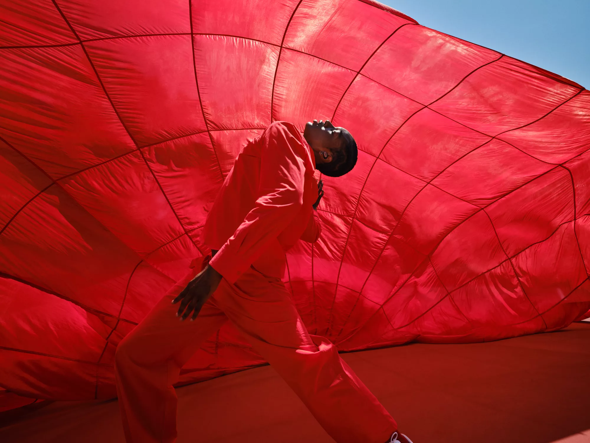 Person dancing outside wearing Bose QuietComfort Ultra Earbuds
