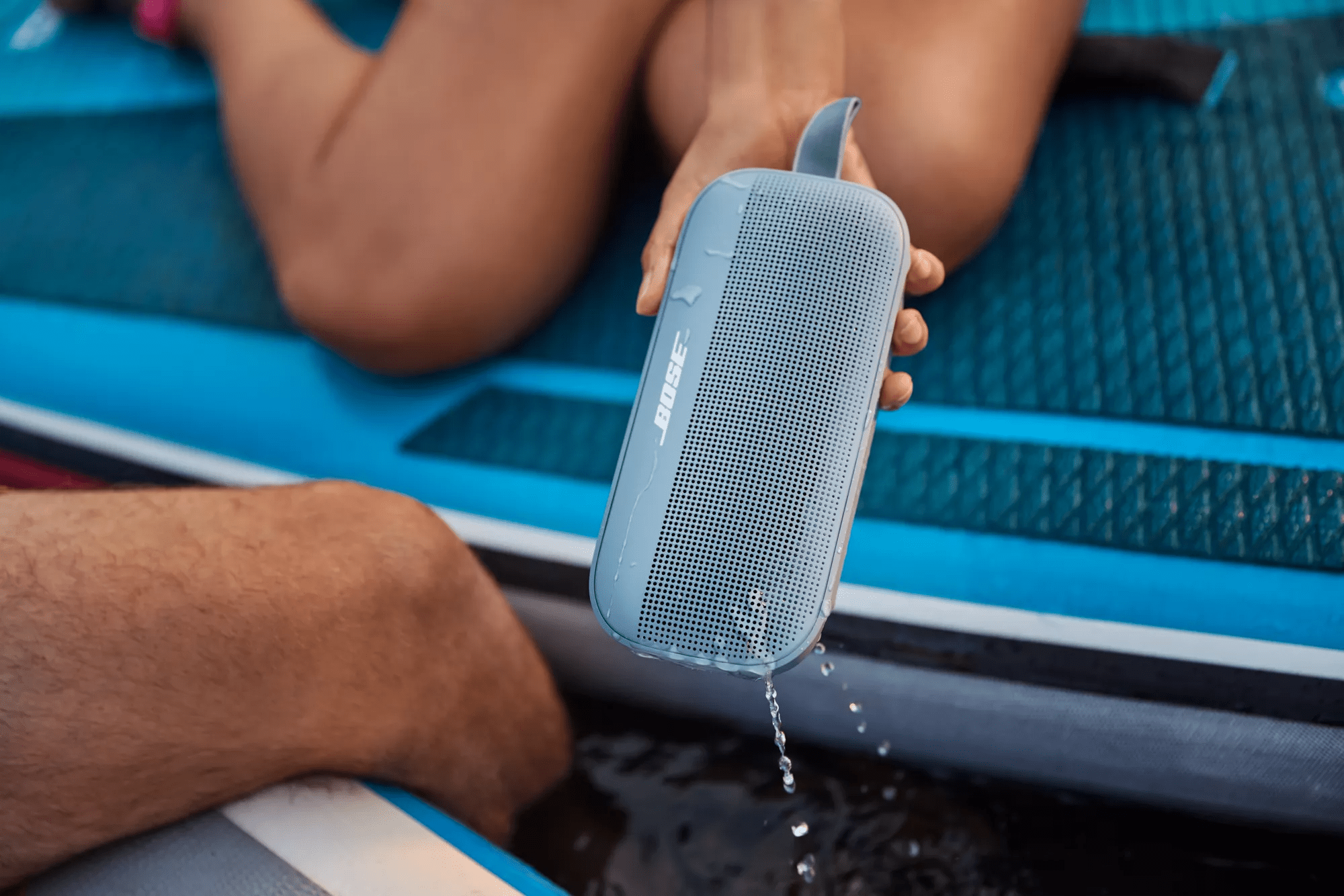 A SoundLink Flex Bluetooth speaker being removed from the water
