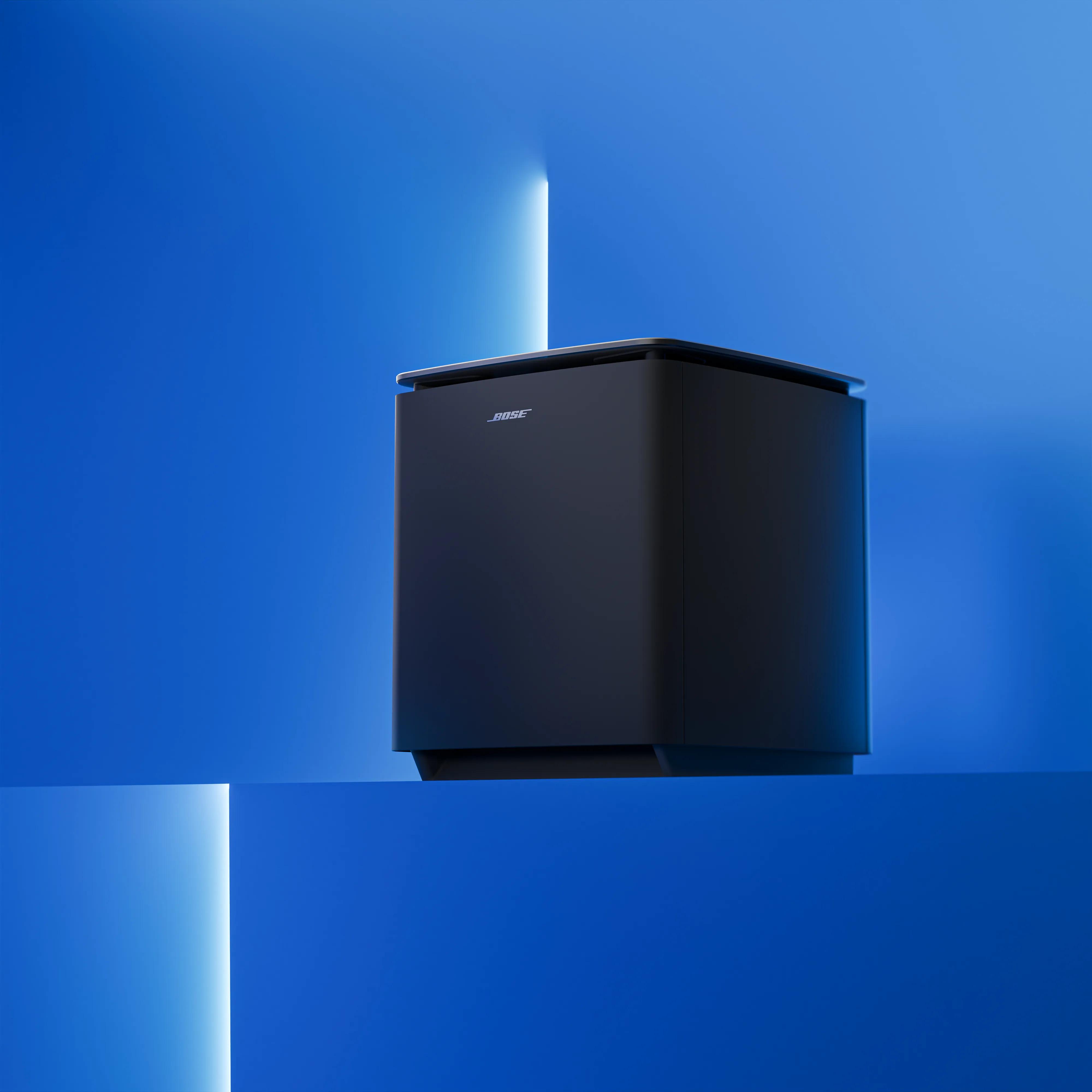 Black Lifestyle Ultra Subwoofer displayed against a vibrant blue backdrop.