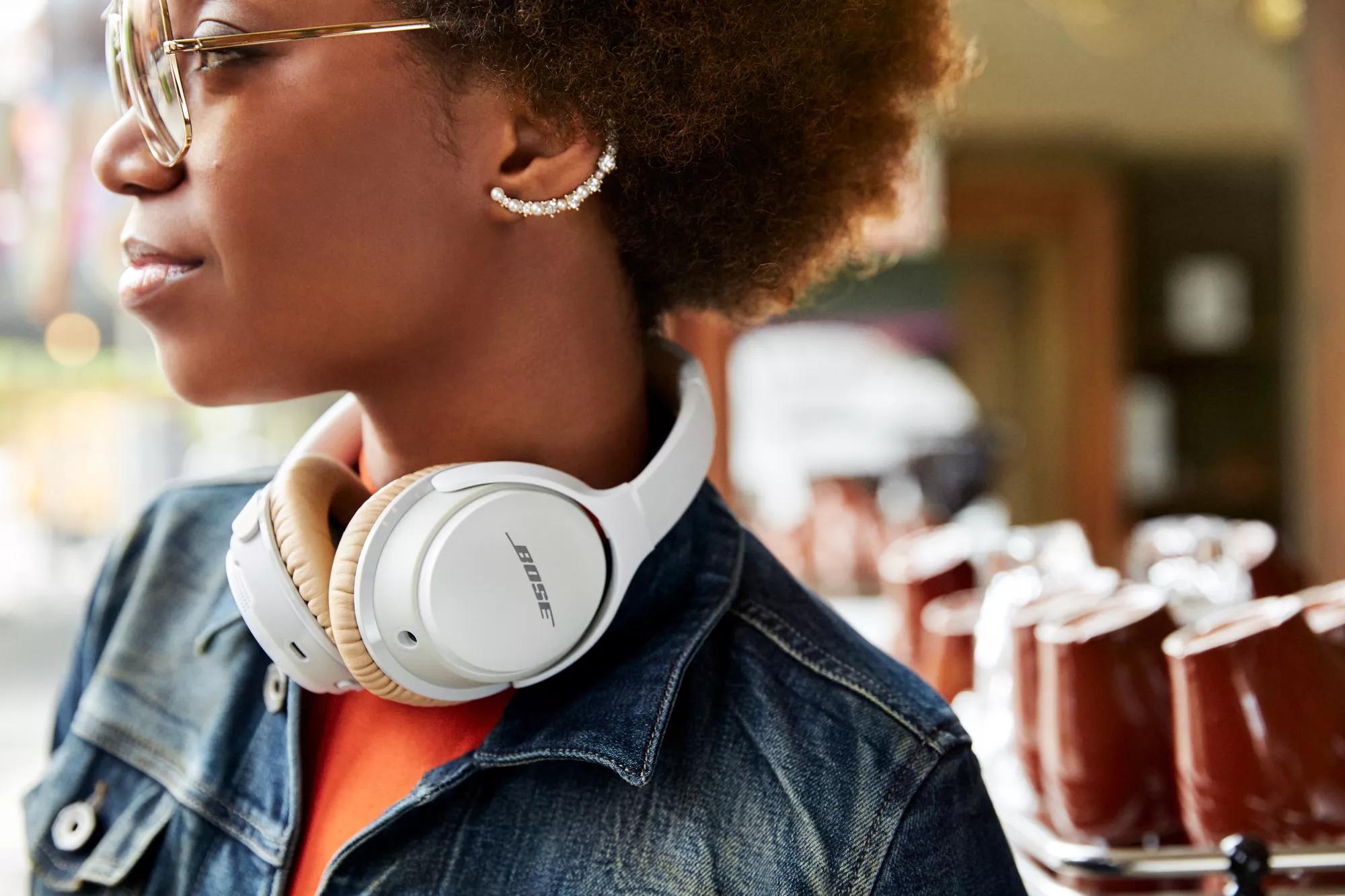 Woman wearing Bose SoundLink around-ear headphones II