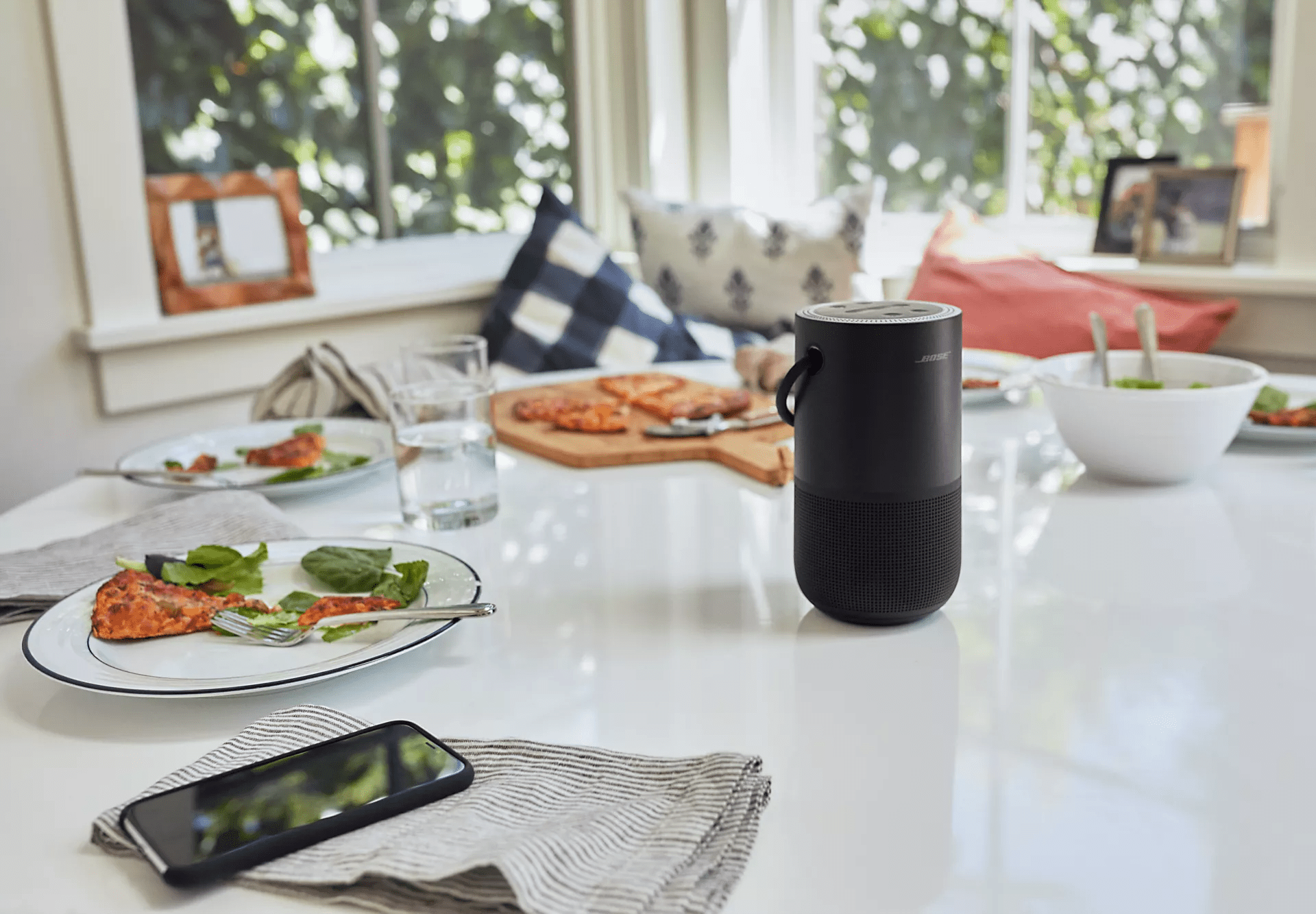 Bose Portable Smart Speaker on a dinner table