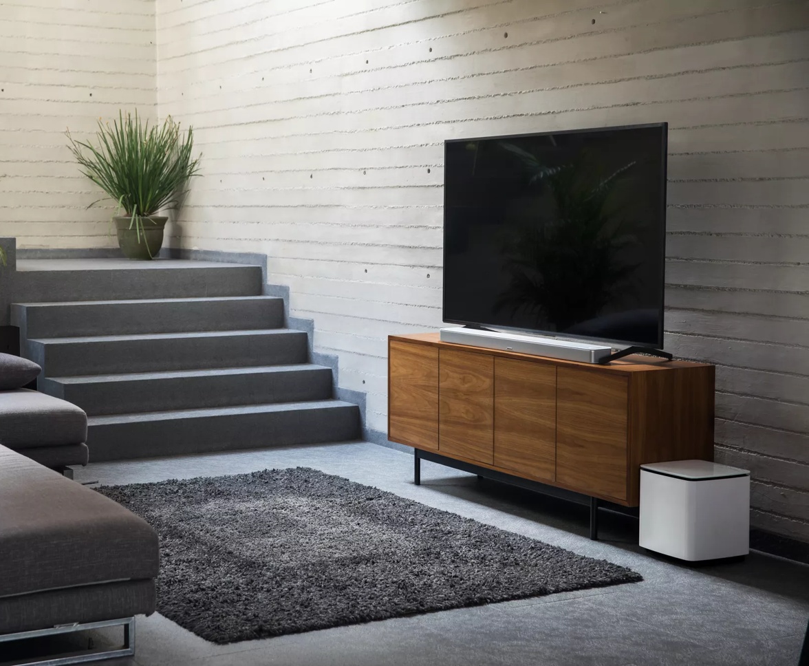 Living room home theater setup with Bose Smart Soundbar 900 and Bass Module 700