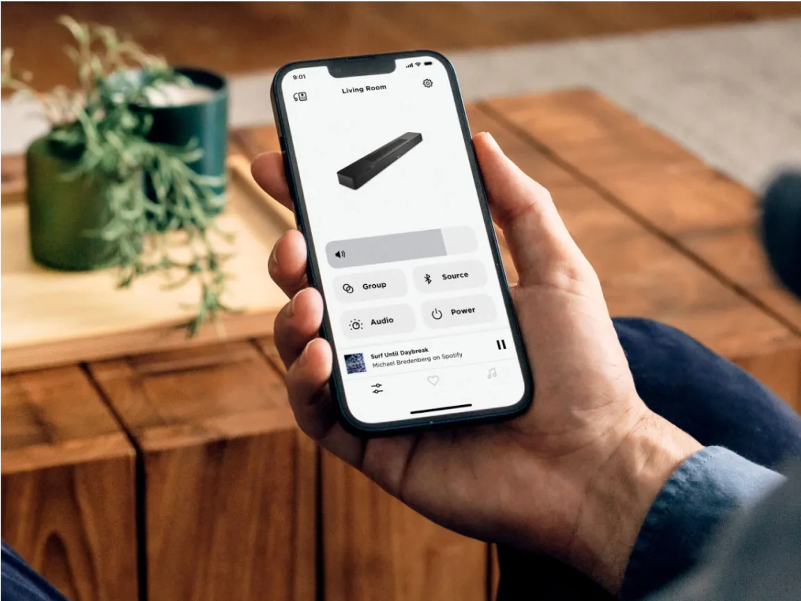 Man using the Bose App for the Bose Smart Soundbar on a smartphone.
