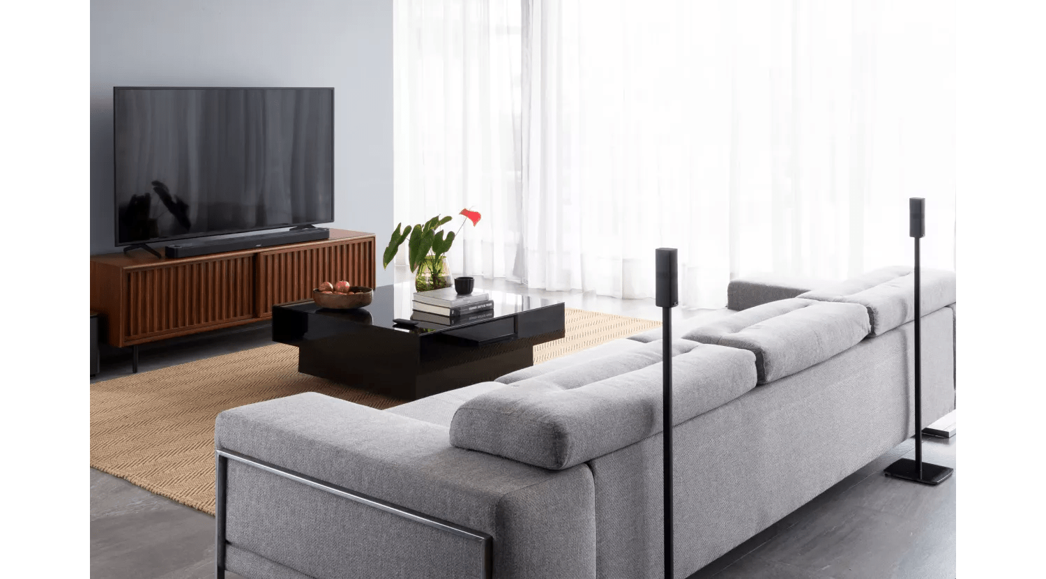 Bose Surround Speakers 700 in a living room on floor speaker stands