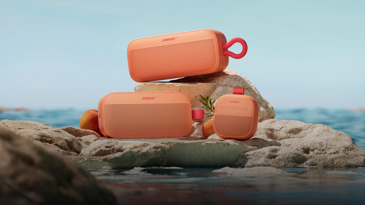  Bose SoundLink Plus Portable Speaker, SoundLink Micro Portable Speaker (2nd Gen), and SoundLink Flex Portable Speaker (2nd Gen) in Sunset Peach.