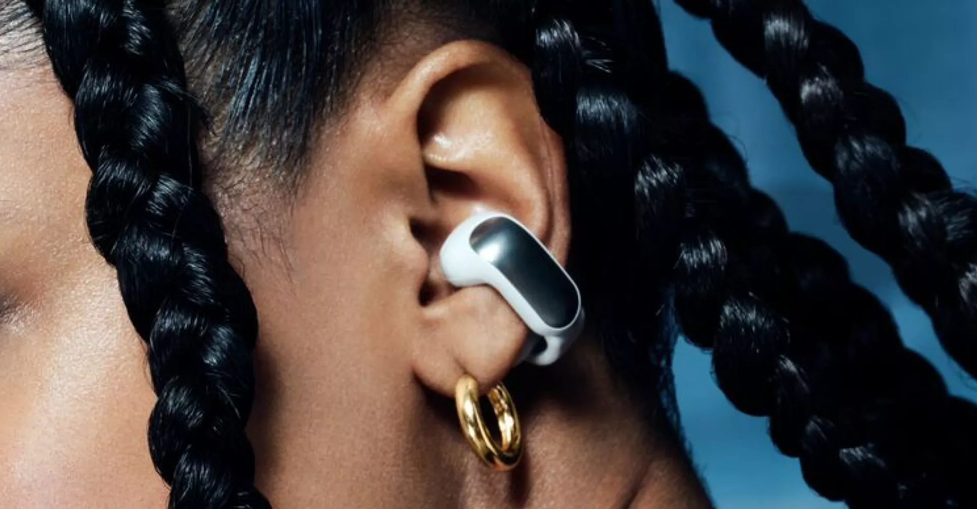 Woman wearing Bose Ultra Open Earbuds
