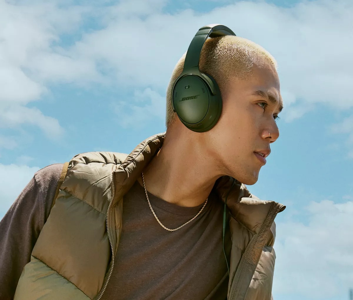  Man wearing Bose QuietComfort Headphones outside