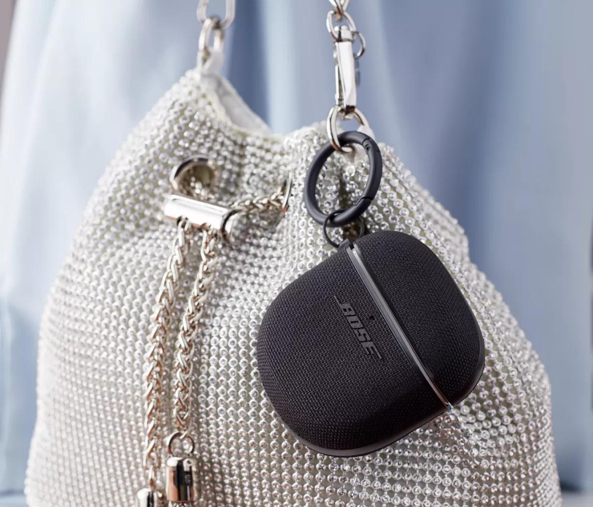 Triple Black Bose QuietComfort Earbuds II Fabric Case Cover attached to a purse