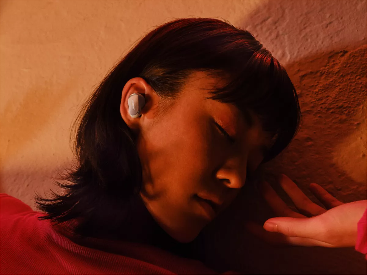 Woman wearing Bose QuietComfort Ultra Earbuds