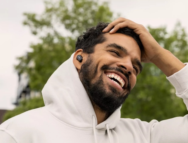 man wearing Bose QuietComfort Earbuds II outside