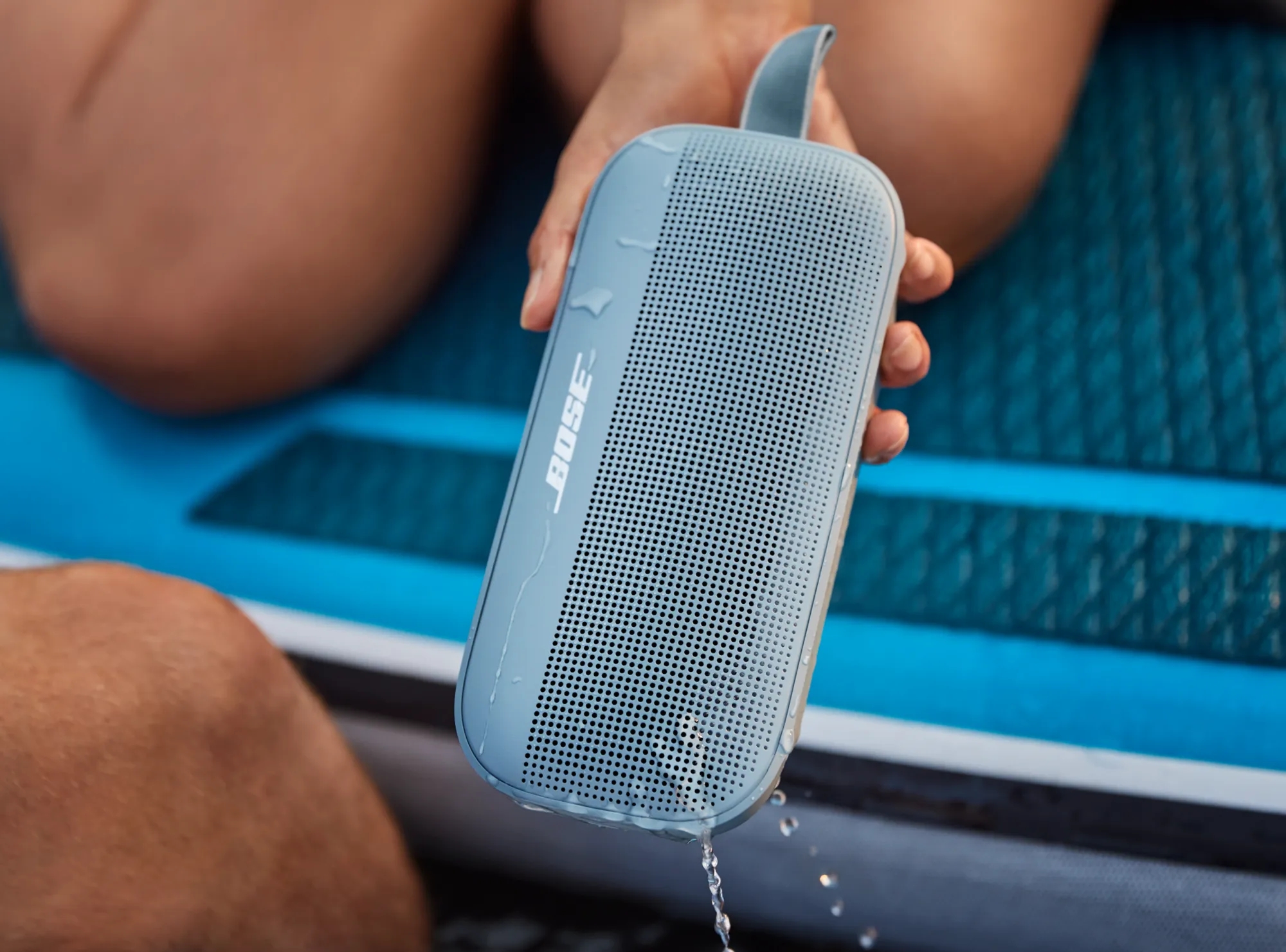 Bose SoundLink Flex Bluetooth Speaker being removed from a lake after being submerged