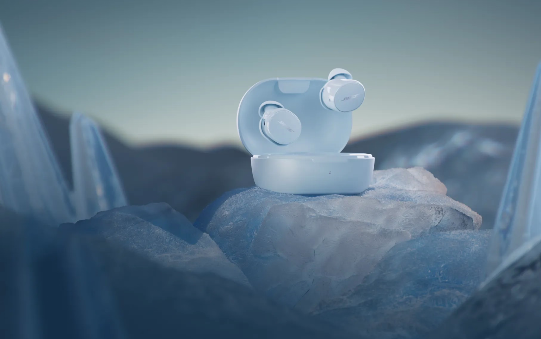  Bose QuietComfort  Earbuds in Ice Blue sitting on glacial ice.