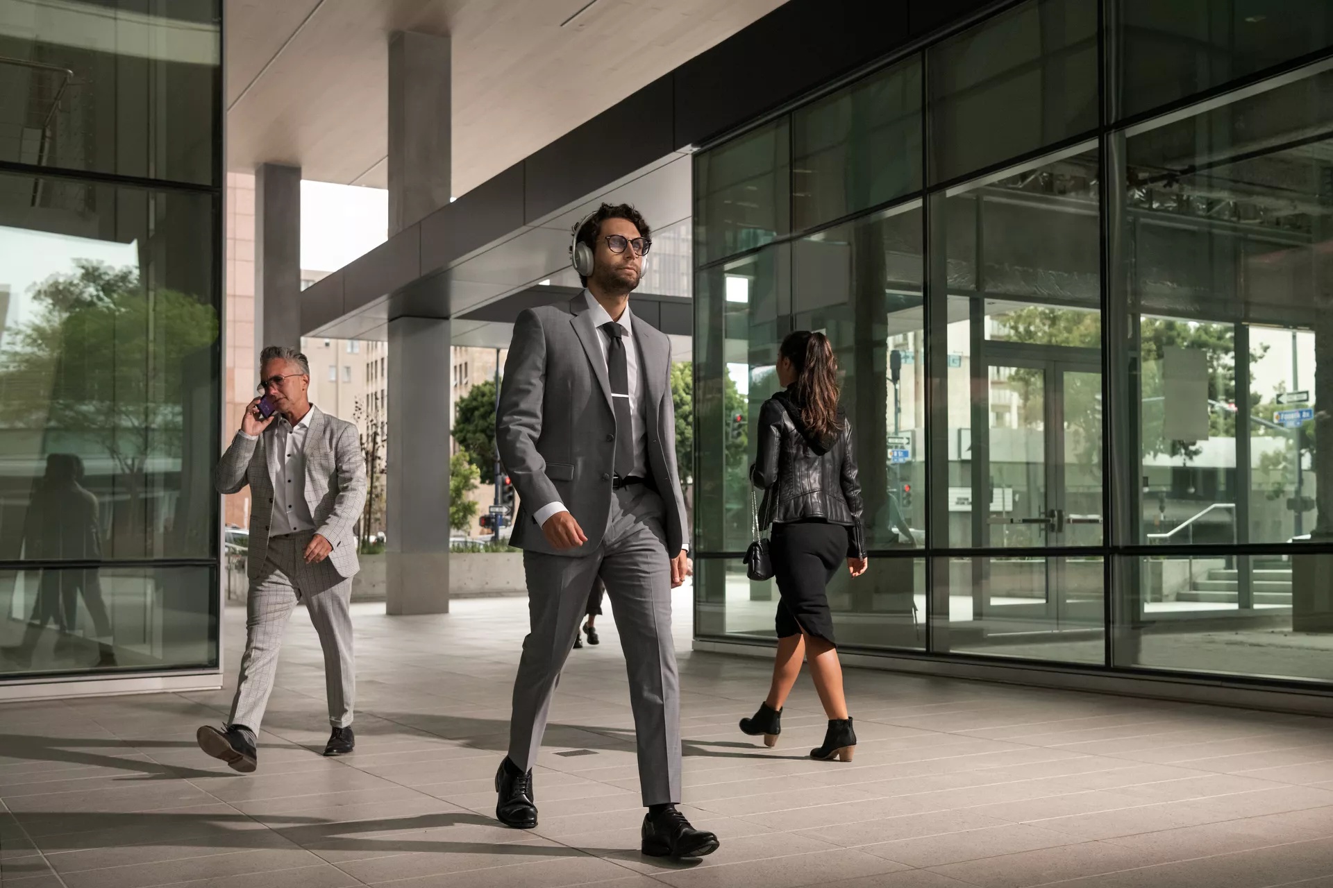 Man in silver suit wearing Bose Noise Cancelling Headphones 700