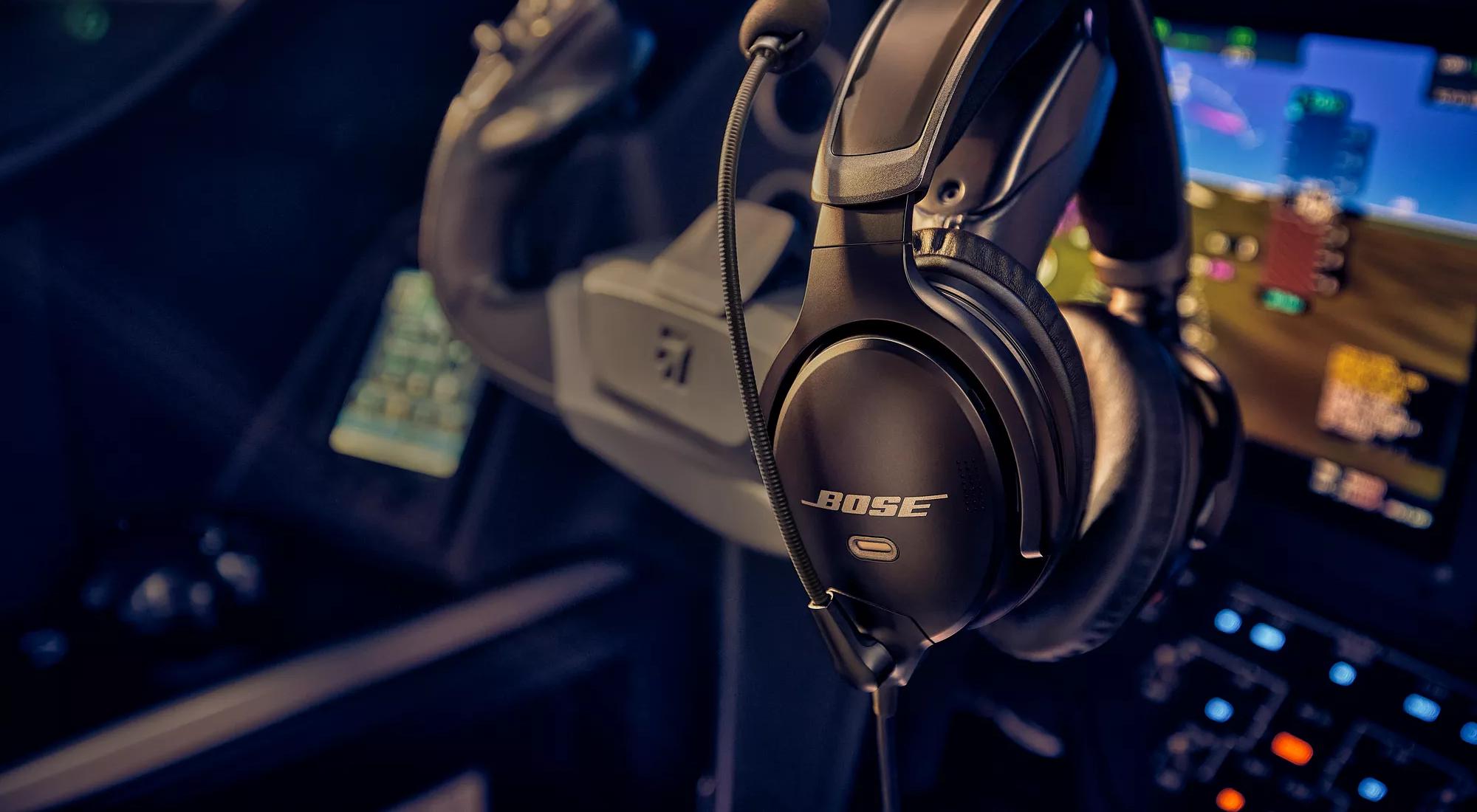 Bose A30 Aviation Headset hanging on the control column of an airplane