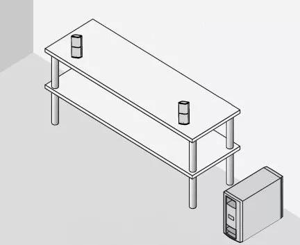 Left and right speakers placed on entertainment center with the Acoustimass module on the floor beside it