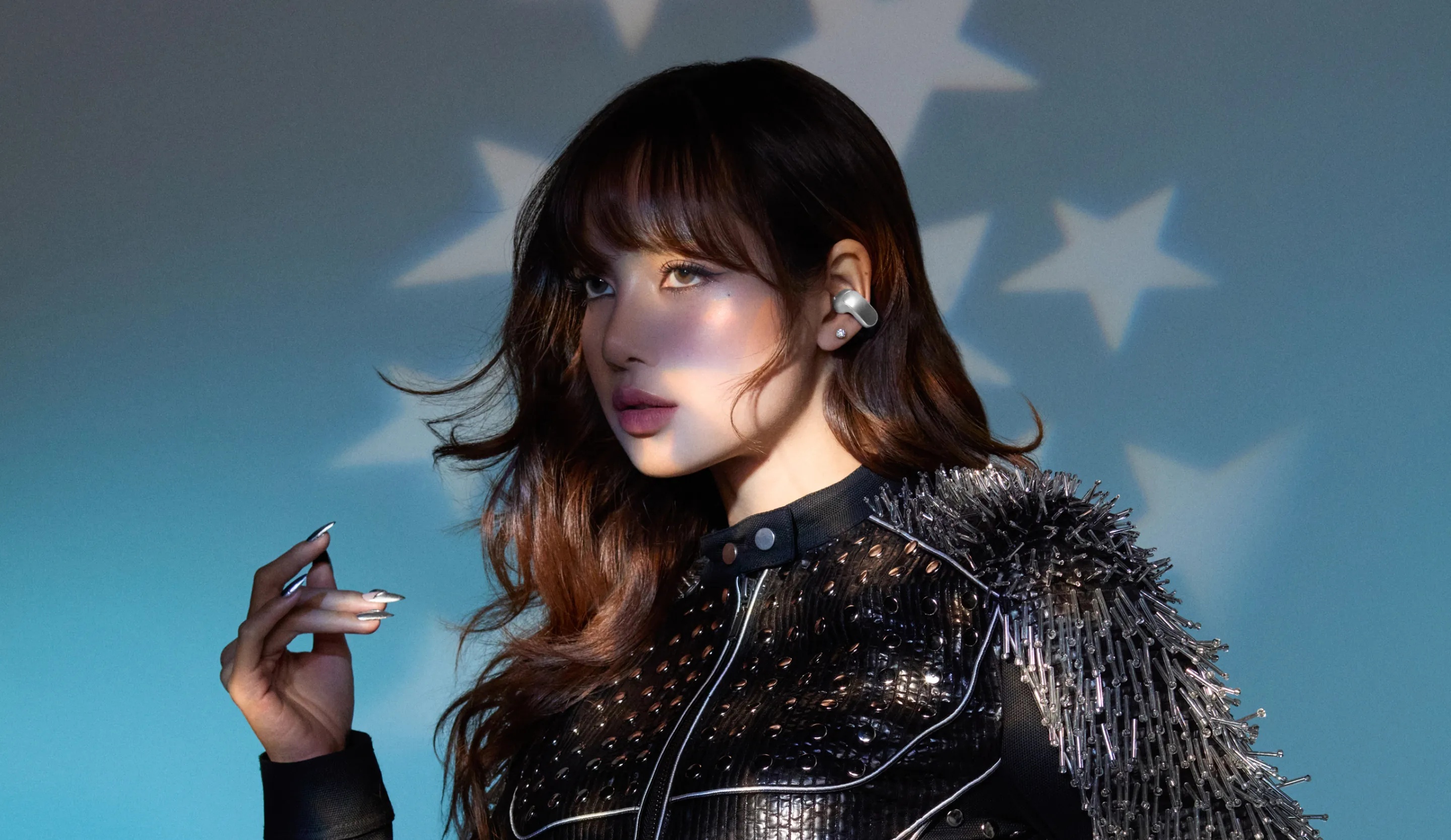 LISA wearing Bose Ultra Open Earbuds.